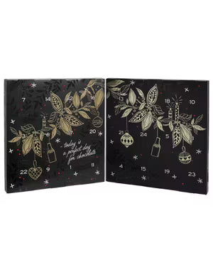 Chokladshopen Anthon Berg likörkalender med 24 luckor och elegant julmotiv i svart och guld.