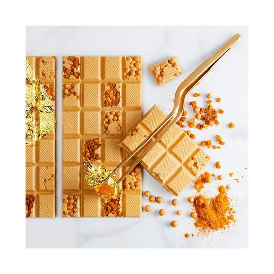Chokladshopen Callebaut Gold karamelliserad vit choklad i form av chokladkaka med guldblad och chokladpellets