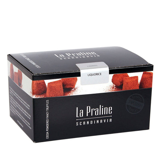 Chokladshopen La Praline tryfflar med lakritssmak i en elegant svart presentask med kakaopudrade tryfflar
